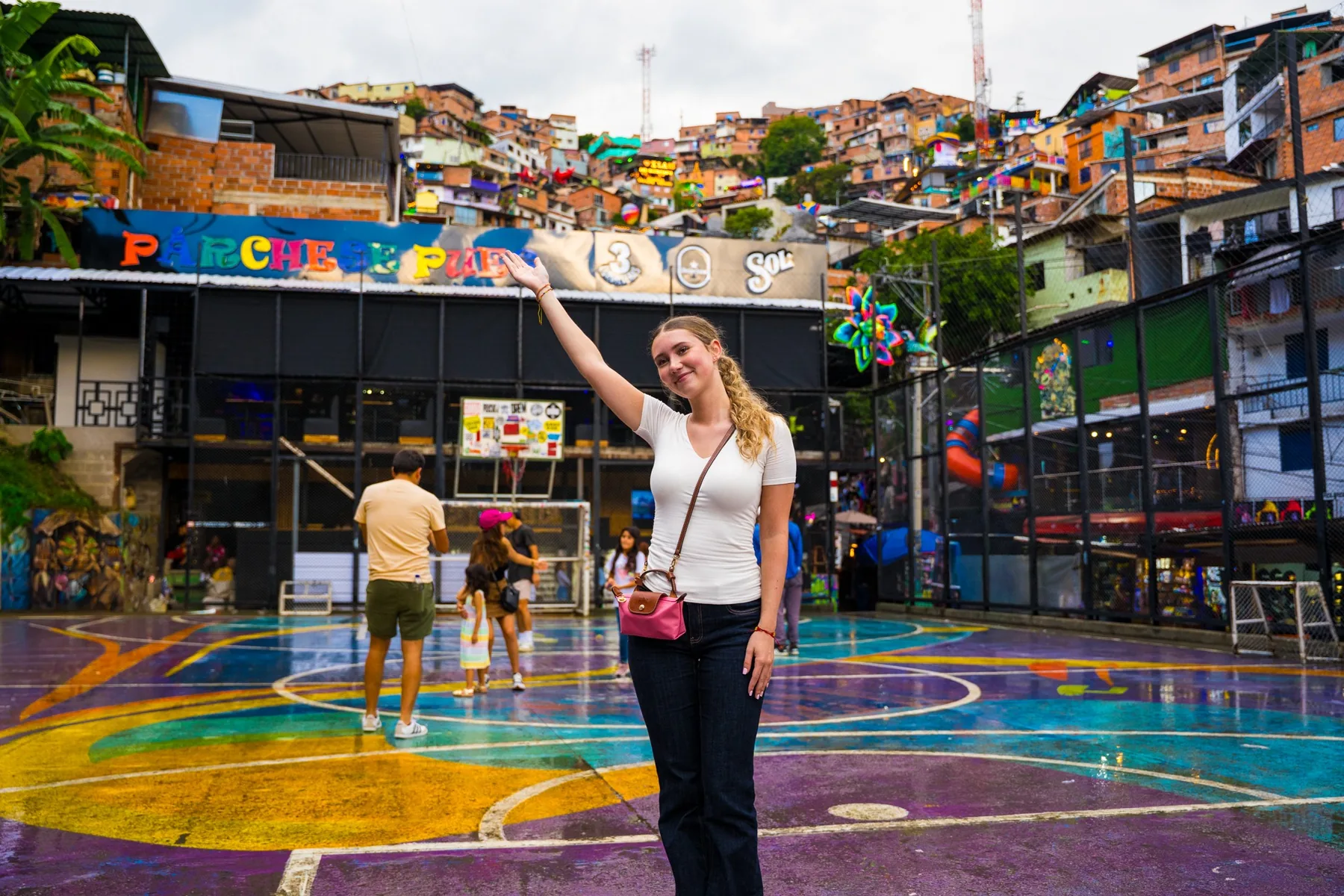 Traveler visiting a colorful neighborhood space in Medellín